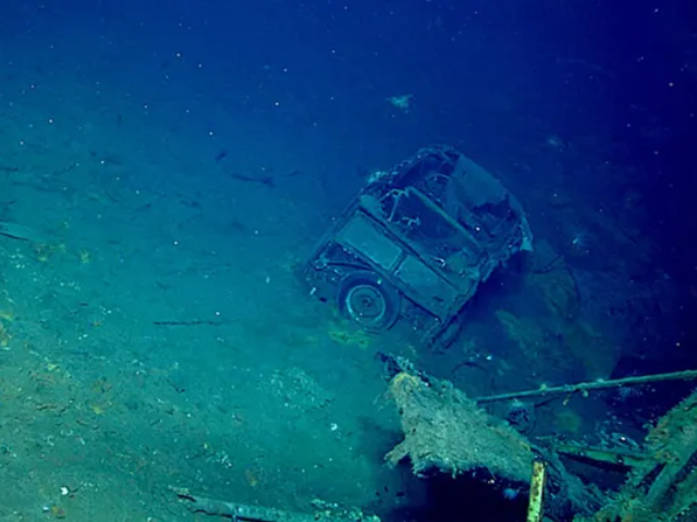 A vintage Ford Super Deluxe vehicle was discovered by divers while exploring the USS Yorktown. (NOAA Ocean Exploration, 2025 Beyond the Blue)