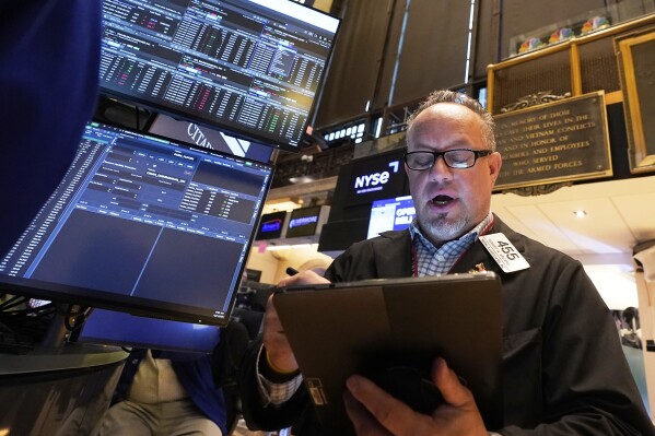 Trader Robert Arciero works on the floor of the New York Stock Exchange, Monday, April 21, 2025. (AP Photo/Richard Drew)