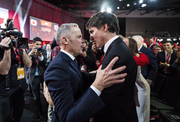 Mark Carney, Leader of the Liberal Party of Canada, embraces Prime Minister Justin Trudeau after being announced the winner at the Liberal Leadership Event in Ottawa, Ontario, March 9, 2025. (Justin Tang/The Canadian Press via AP, File)