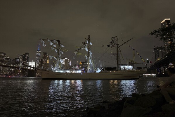 A masted Mexican Navy training ship, the Cuauhtémoc, sits stranded after colliding with the Brooklyn Bridge in New York on Saturday, May 17, 2025. (AP Photo/Kyle Viterbo)