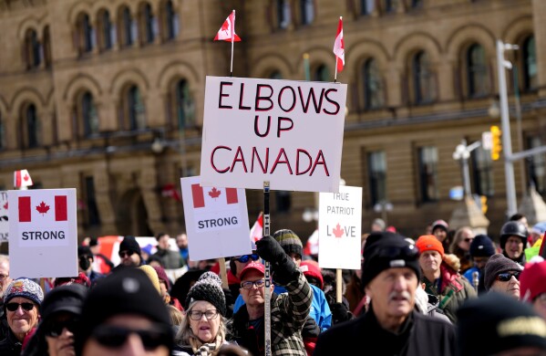 People rally in response to U.S. President Donald Trump's threats to Canadian sovereignty on Parliament Hill in Ottawa, March 9, 2025. (Justin Tang/The Canadian Press via AP, File)