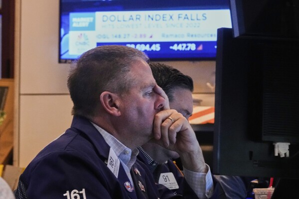 Trader Thomas McCauley works on the floor of the New York Stock Exchange, Monday, April 21, 2025. (AP Photo/Richard Drew)