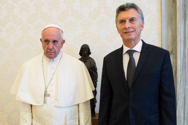 Pope Francis and Argentina's president Mauricio Macri pose for a picture during a private audience at the Vatican, Feb. 27, 2016. (L'Osservatore Romano/Pool Photo via AP)