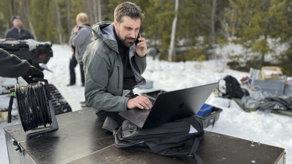 This undated photo, issued by SVT, shows preparations in Junsele, Sweden for the livestream 'The Great Moose Migration' to document the annual Moose migration near Kullberg in northern Sweden. (SVT via AP)