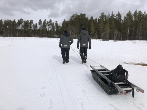 This undated photo, issued by SVT, shows preparations in Junsele, Sweden for the livestream 'The Great Moose Migration' to document the annual Moose migration near Kullberg in northern Sweden. (SVT via AP)