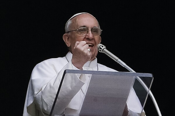 Pope Francis gestures as he delivers his Angelus prayer from the window of his studio overlooking St. Peter's Square, at the Vatican, Sunday, March 17, 2013. Breaking with tradition, Pope Francis delivered off-the-cuff remarks about God's power to forgive instead of reading from a written speech for the first Sunday window appearance of his papacy. He also spoke only in Italian, beginning with 