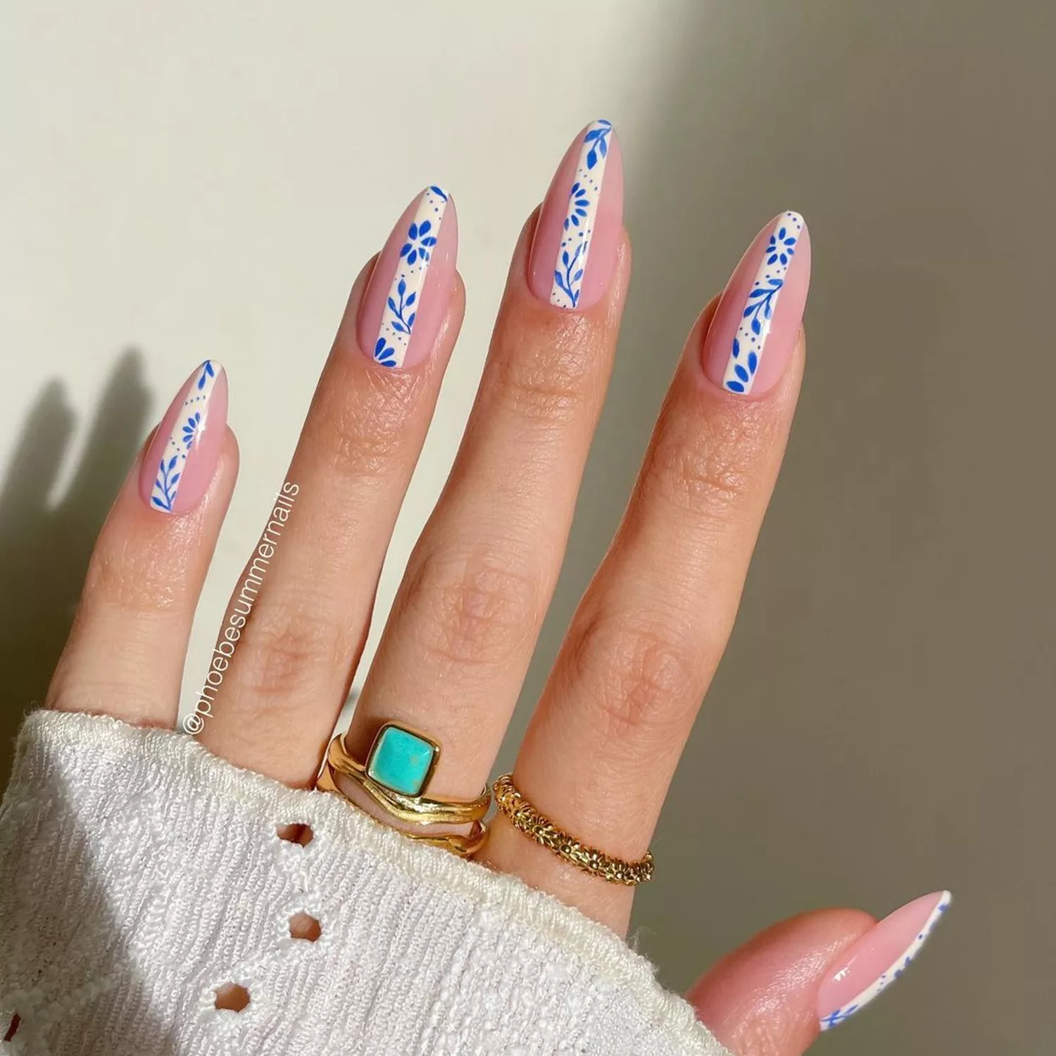 Sheer pink nails with blue and white striped nail art - Byrdie Bubble Bath Nails