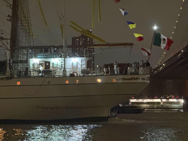 A Mexican navy ship sits in the water after it hit the Brooklyn Bridge on Saturday, May 17, 2025 in New York. (AP Photo/Kyle Viterbo)