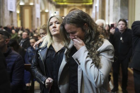 A worshipper cries during Mass at the Cathedral in Buenos Aires, Argentina, following the Vatican's announcement of Pope Francis' death, Monday, April 21, 2025. (AP Photo/Natacha Pisarenko)