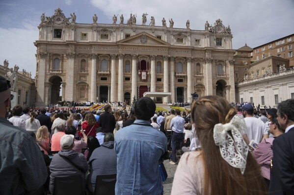 Pope Francis appears on the central lodge of St. Peter's Basilica to bestow the Urbi et Orbi (Latin for to the city and to the world) blessing at the end of the Easter mass presided over by Cardinal Angelo Comastri in St. Peter's Square at the Vatican Sunday, April 20, 2025. (AP Photo/Andrew Medichini)