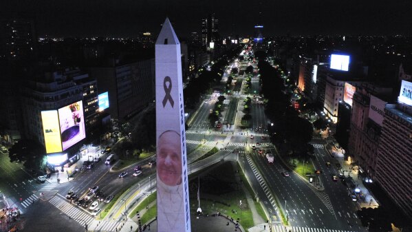 A photo of the late Pope Francis is projected onto the Obelisk in Buenos Aires, Argentina, Monday, April 21, 2025. (AP Photo/Gustavo Garello)