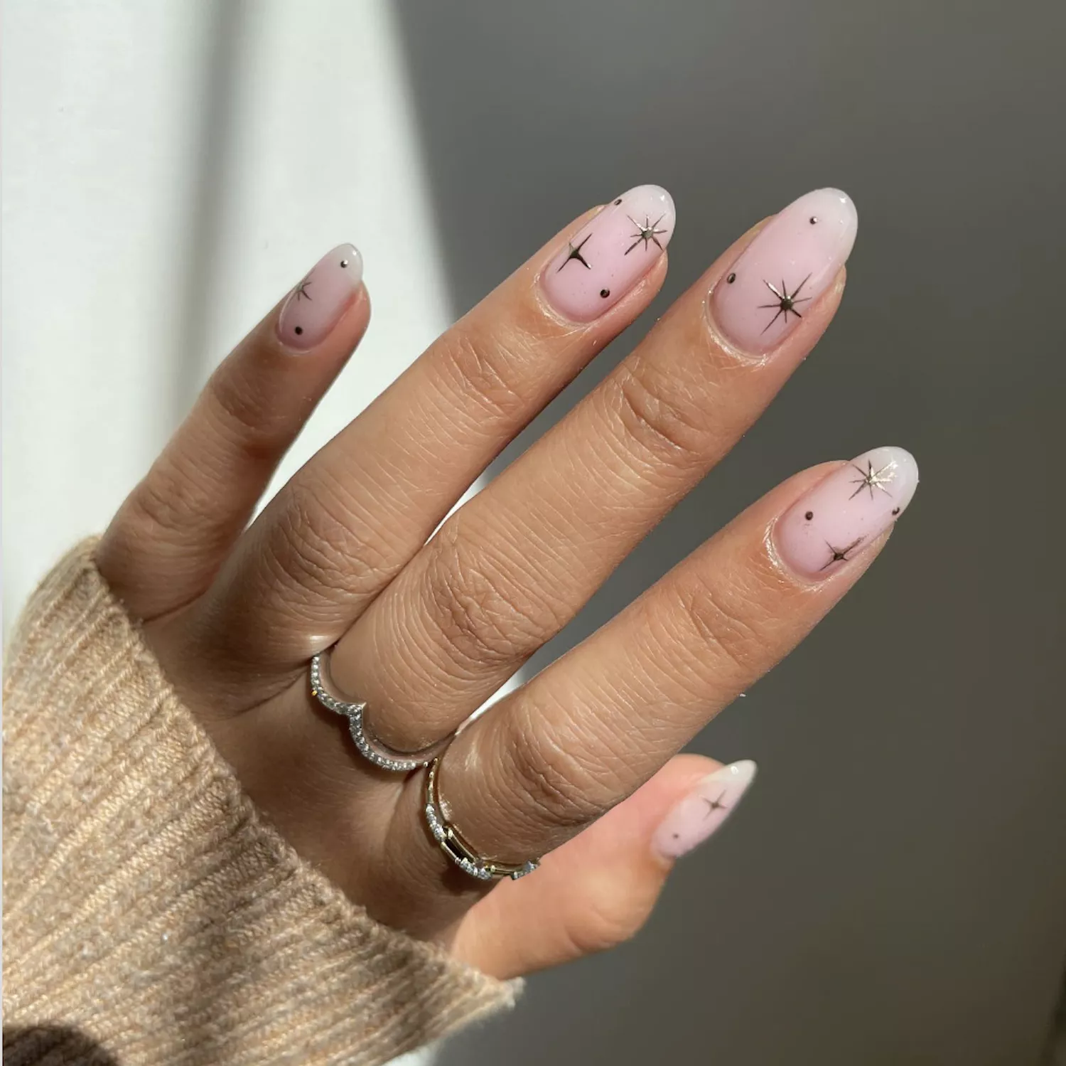 strawberry milk nails with gold stars
