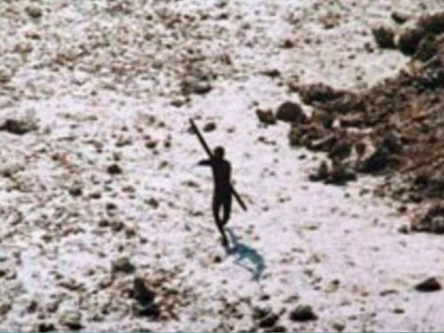 In the wake of the 2004 tsunami this member of the Sentinelese tribe was photographed firing arrows at a helicopter. (Supplied: Indian Coastguard/Survival International)