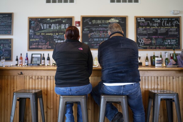 Rose and Paul Wells taste wine at Fox Run Vineyards, Saturday, March 22, 2025, in Penn Yan, N.Y. (Natasha Kaiser via AP)