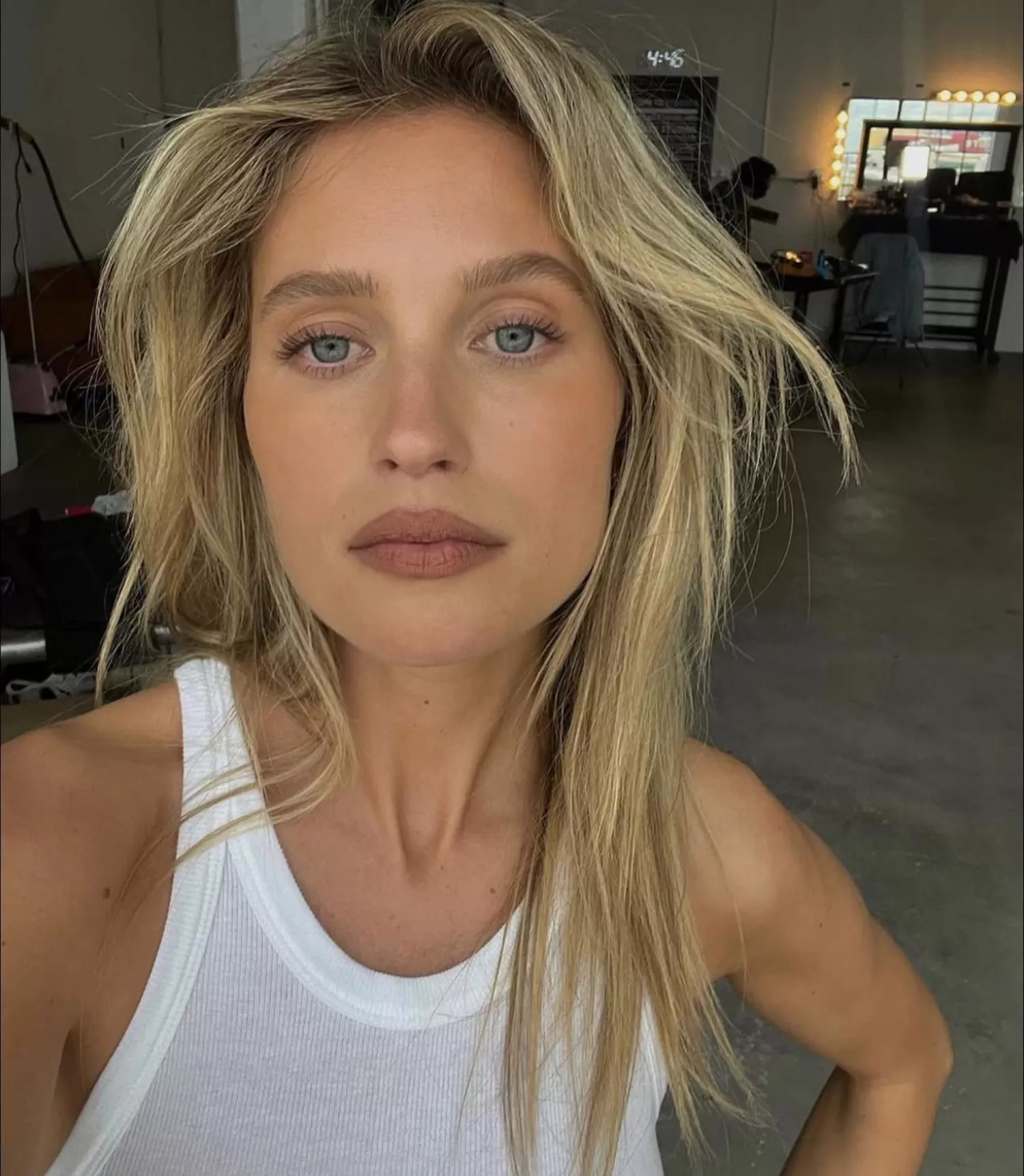 model poses wearing natural nude makeup look